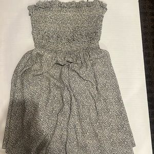 short dress, small ruffles at the top and in good condition